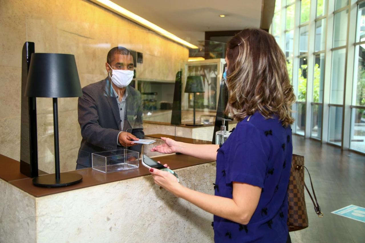 Radisson Vila Olimpia Sao Paulo Exterior photo A guest checking in at a hotel